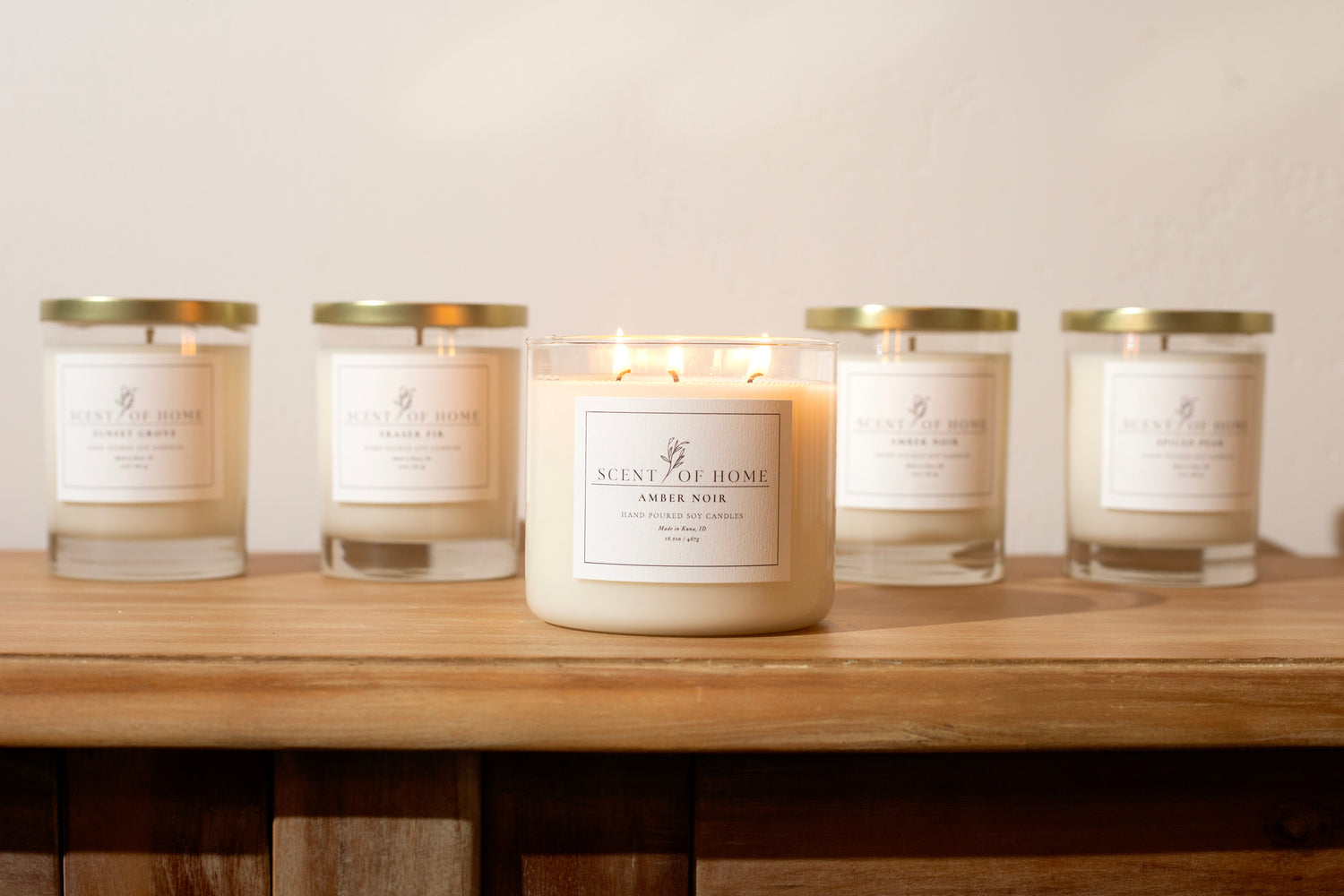 Scent of Home The Collection — luxury hand-poured soy candles with clean, non-toxic ingredients, featuring Amber Noir and other signature fragrances