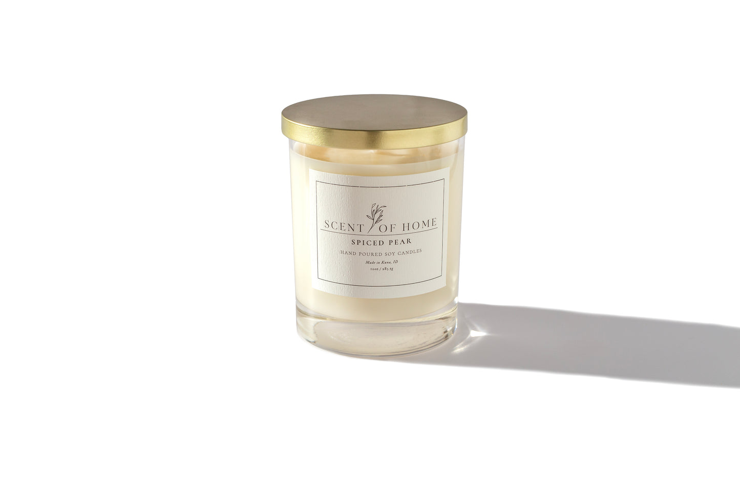 Scent of Home Spiced Pear candle with gold lid on a white background — hand-poured soy candle featuring a warm blend of pear, spice, and cozy sweetness
