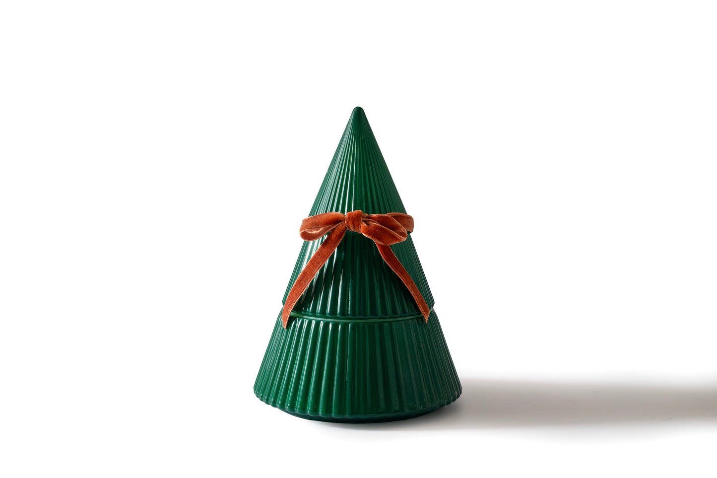 Frosted Juniper Christmas Tree candle in a green ribbed tree-shaped vessel with a velvet bow, on a white background.