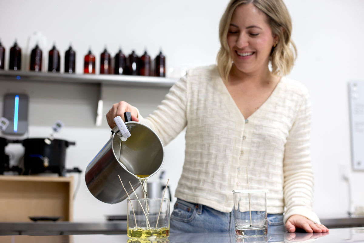 Scent of Home founder hand-pouring small-batch soy candles — made with clean ingredients and crafted with care in Idaho